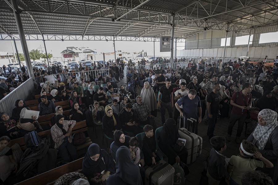 Rafah border crossing between Gaza and Egypt opens to allow limited evacuations